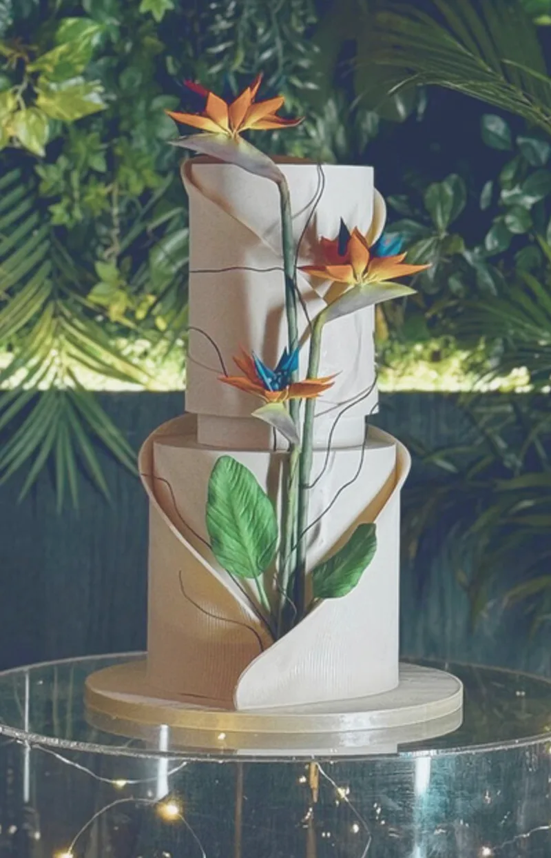 Elegant tiered cake with bird of paradise flowers