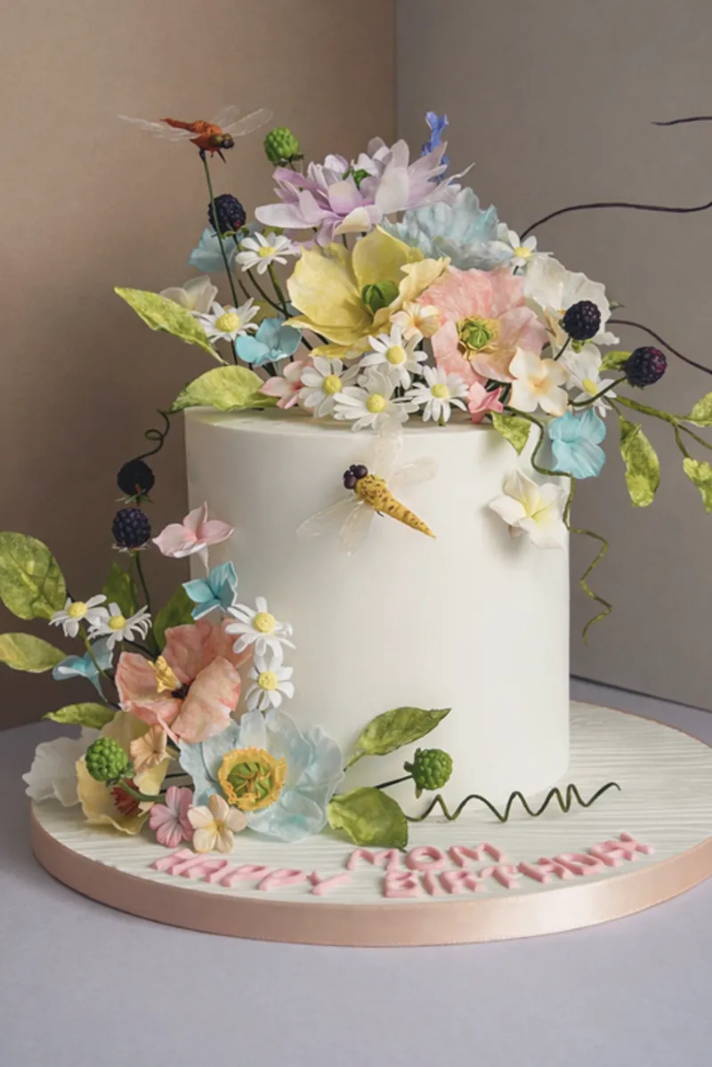 Floral fondant cake with sugar flowers and dragonflies